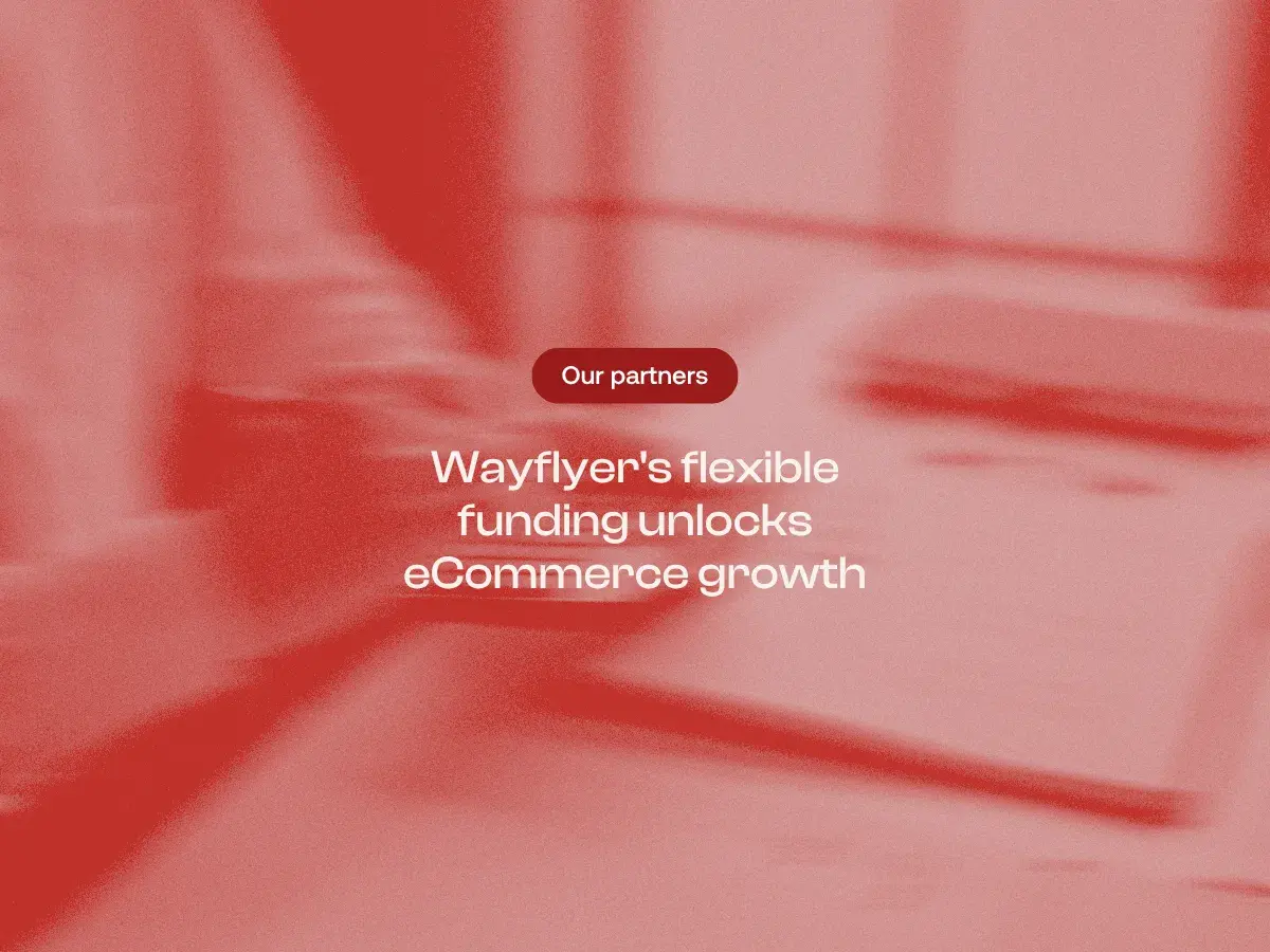 A red-tinted, motion-blurred image of a person using a calculator with text in the center that reads: 