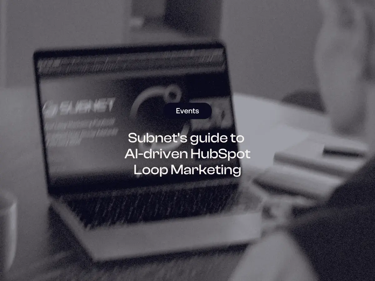 A laptop displaying a presentation slide with the Subnet logo and 